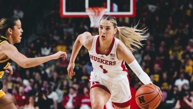 Nebraska's Jaz Shelley dribbles the ball upcourt against the Hawkeyes during the first half Sunday at Pinnacle Bank Arena in Lincoln.